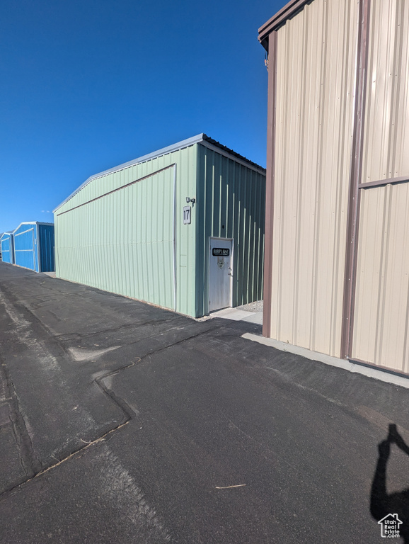 View of outdoor structure with an outbuilding