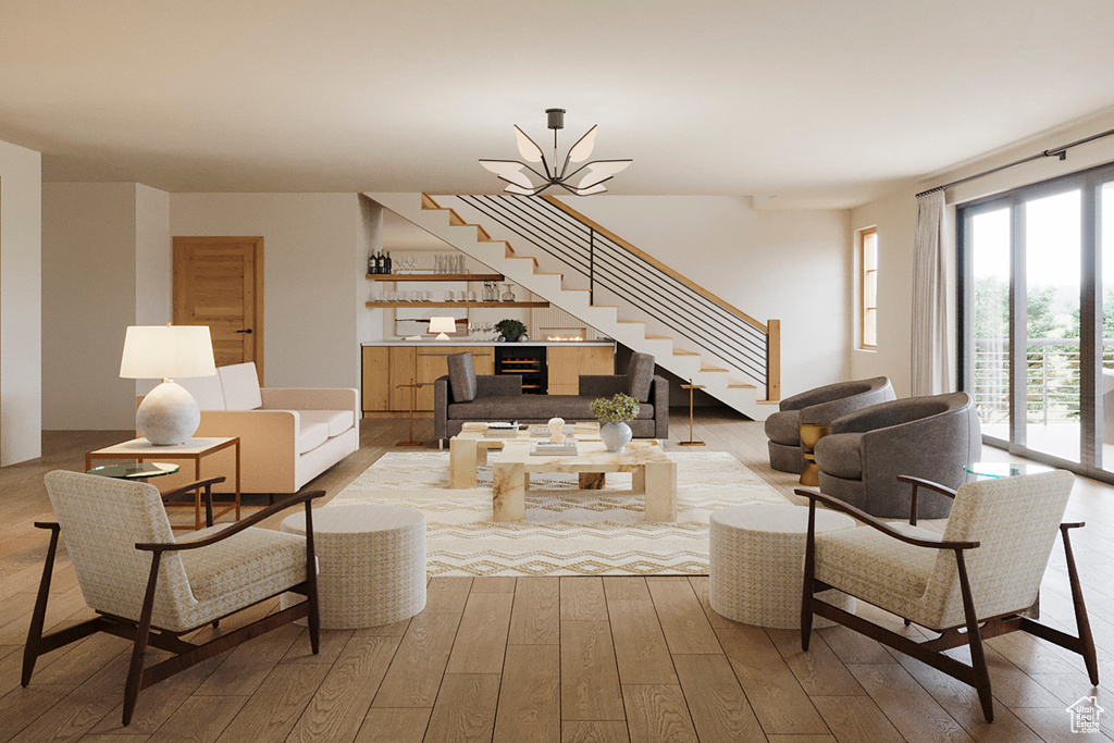 Living area featuring stairs, hardwood / wood-style flooring, and bar area