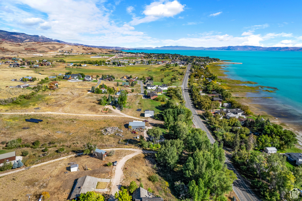 Aerial overview of property's location with a water and mountain view