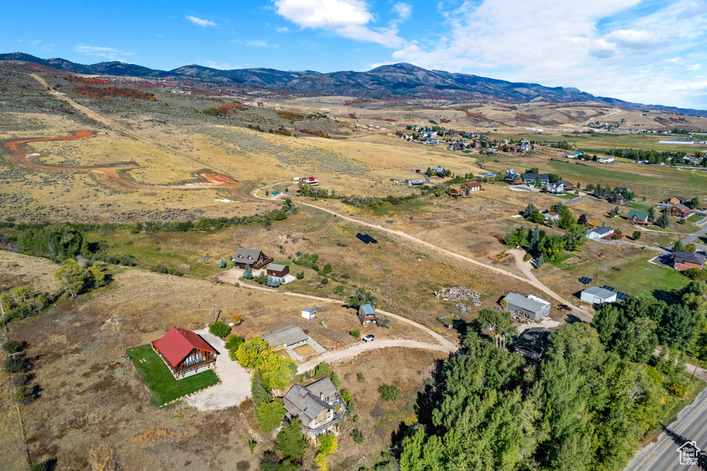 View of property location with a mountain backdrop and rural landscape