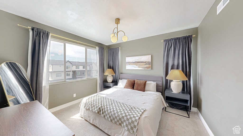 Carpeted bedroom with baseboards