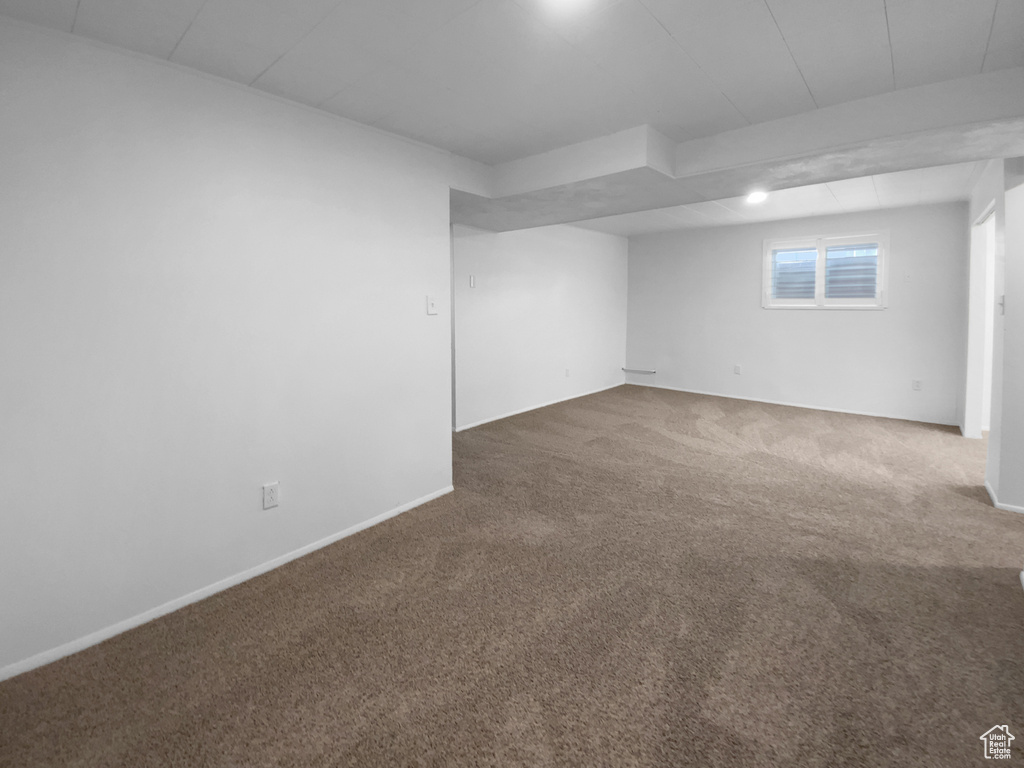 Basement with carpet and baseboards