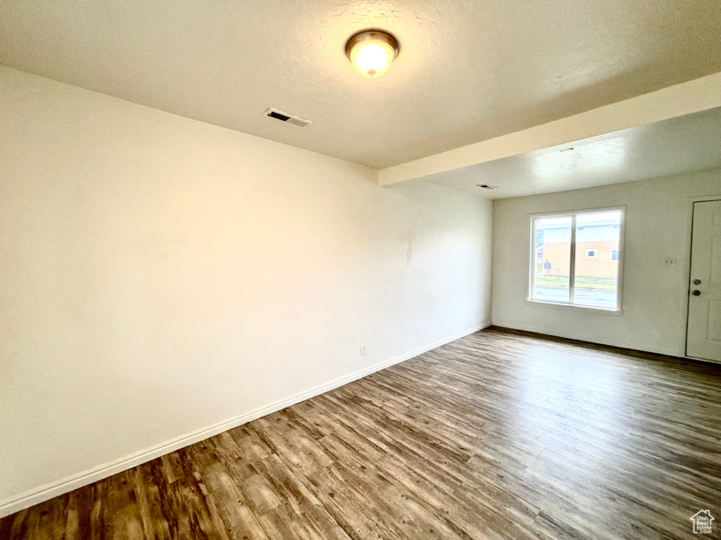 Empty room with wood finished floors and baseboards