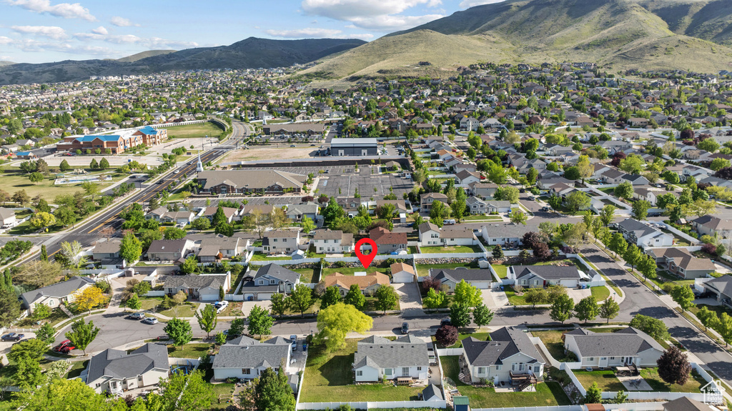 Aerial overview of property\'s location featuring a mountainous background and nearby suburban area