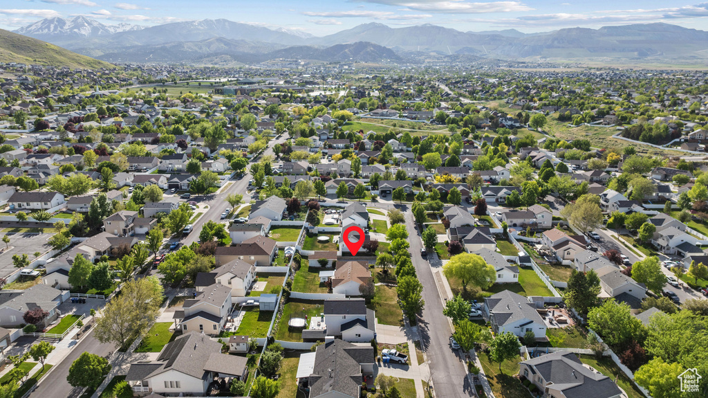Aerial view of property\'s location with mountains and nearby suburban area
