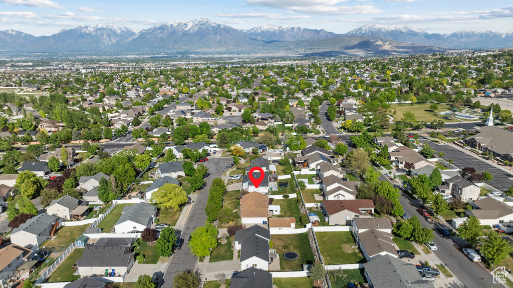 View of property location featuring mountains and nearby suburban area