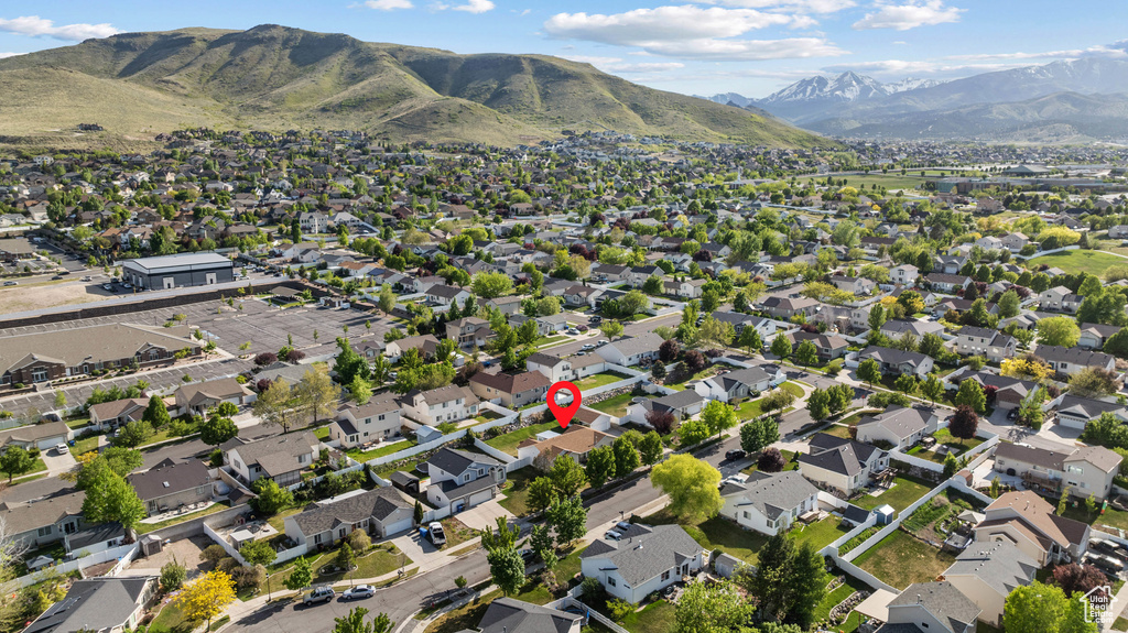 Aerial view of property\'s location with mountains and nearby suburban area