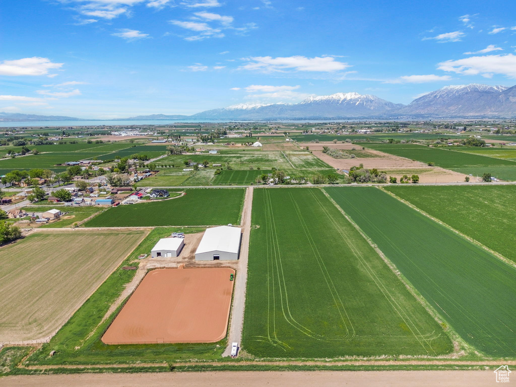 Overview of rural landscape featuring a mountainous background