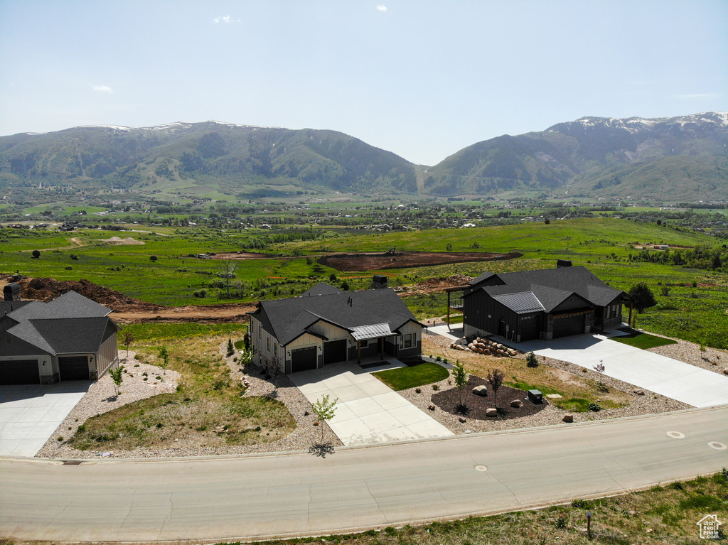 Aerial view of sparsely populated area with a mountain backdrop