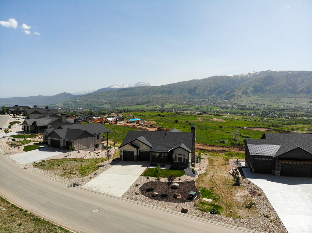 View of mountain backdrop featuring nearby suburban area
