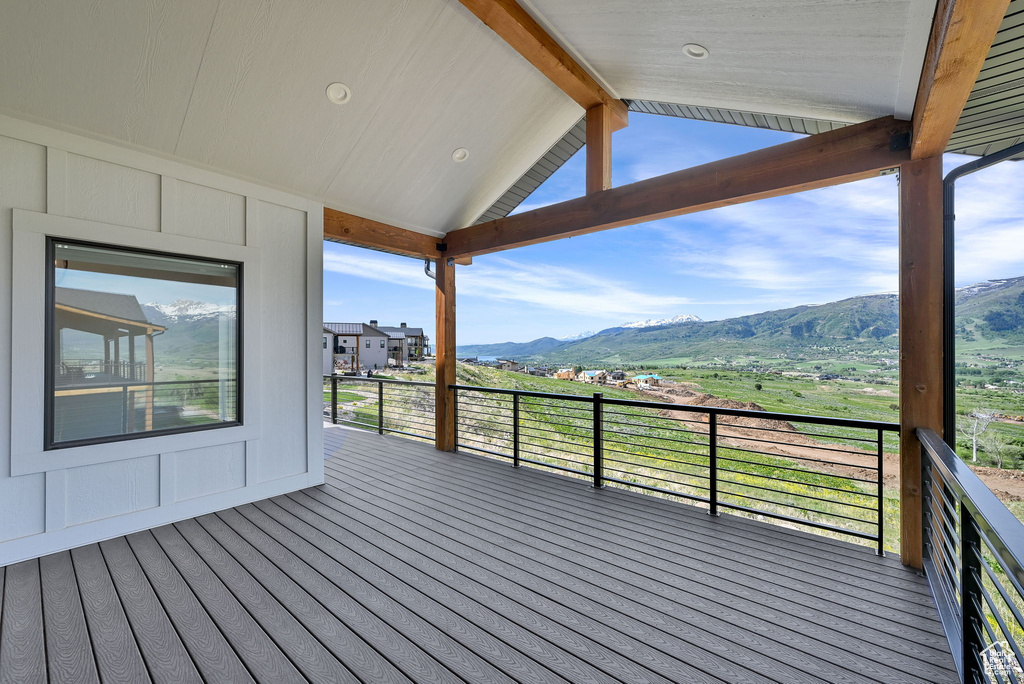 Wooden terrace featuring a mountain view