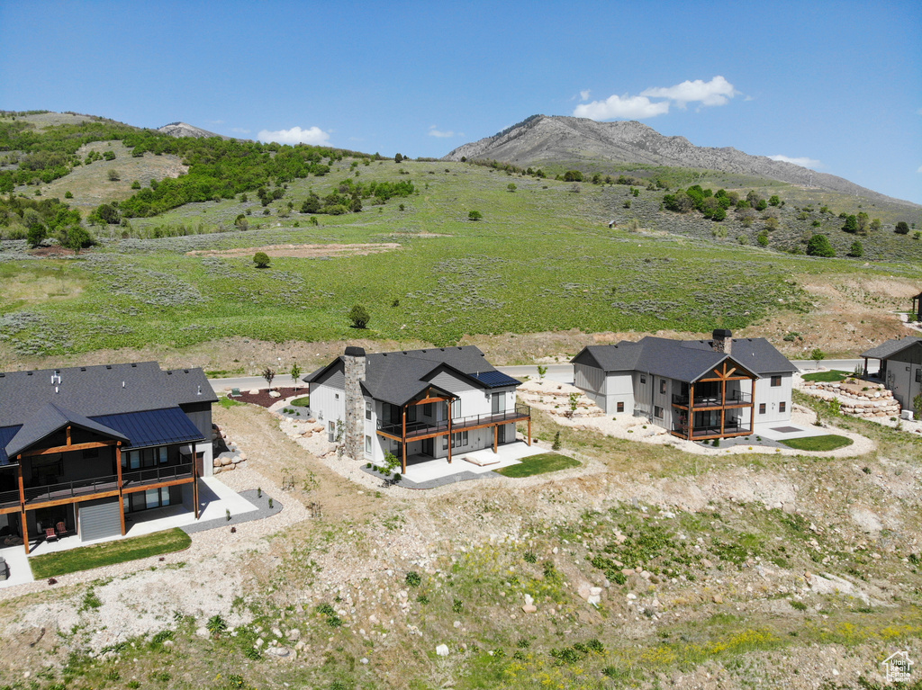 View of subject property featuring a mountain backdrop