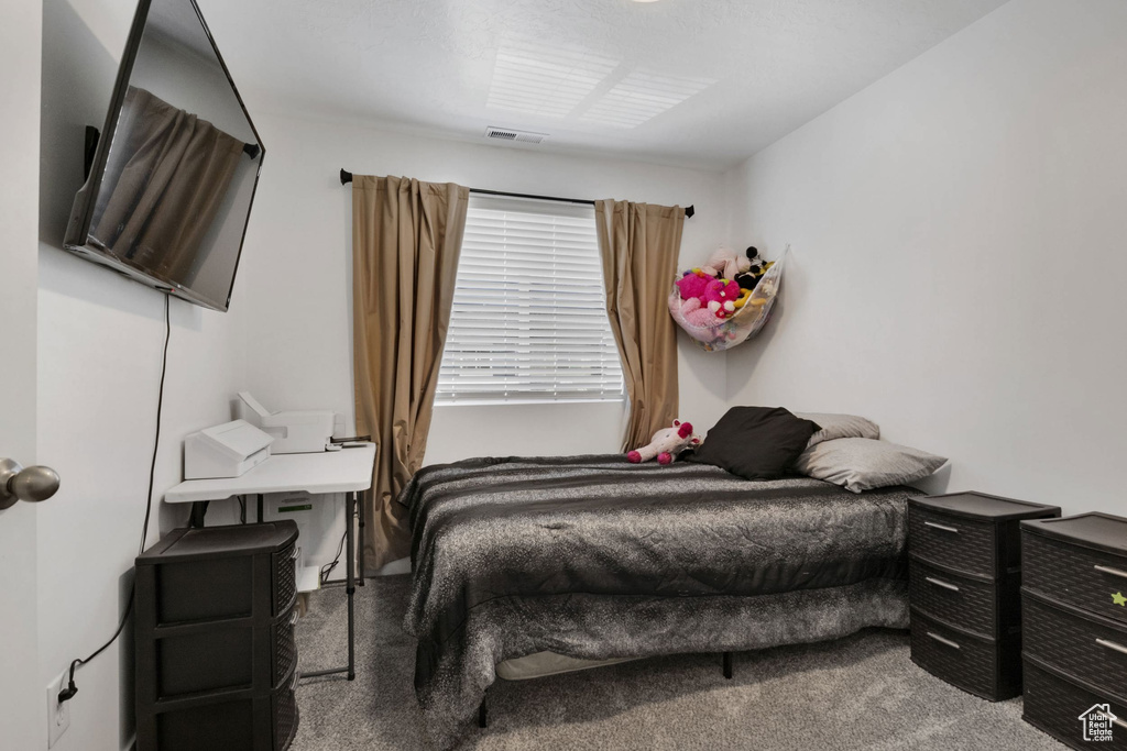 Bedroom featuring carpet flooring