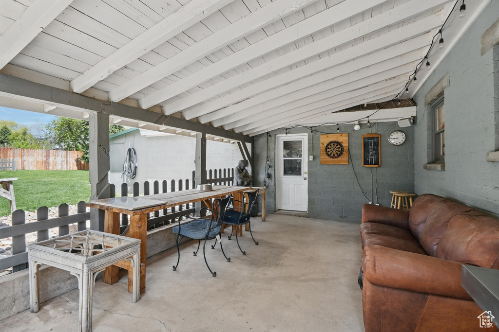View of patio featuring fence, outdoor lounge area, and outdoor dining area