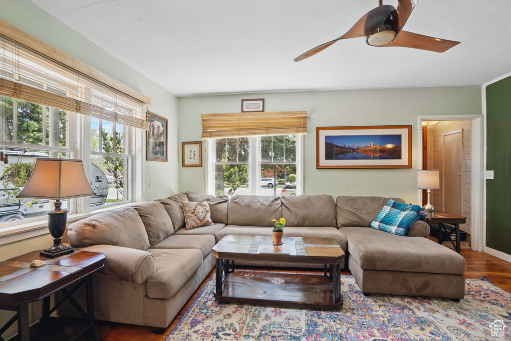 Living room with wood finished floors and ceiling fan