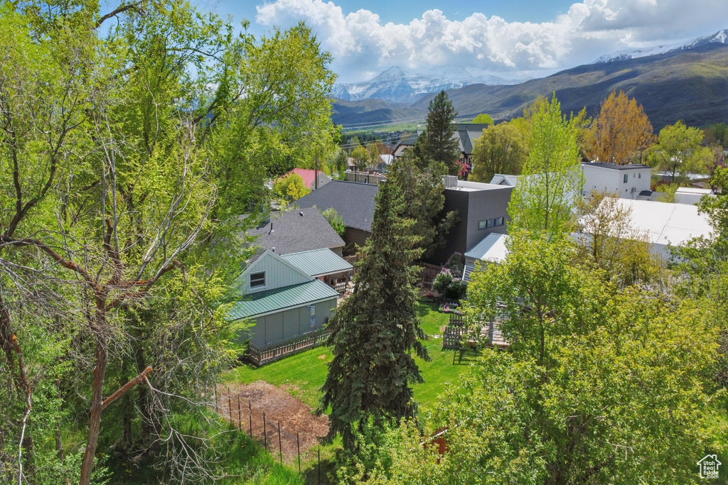 View of subject property featuring a mountainous background