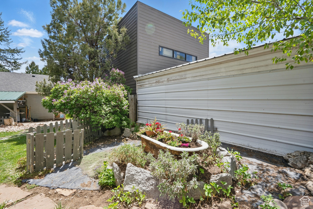 View of side of property with fence