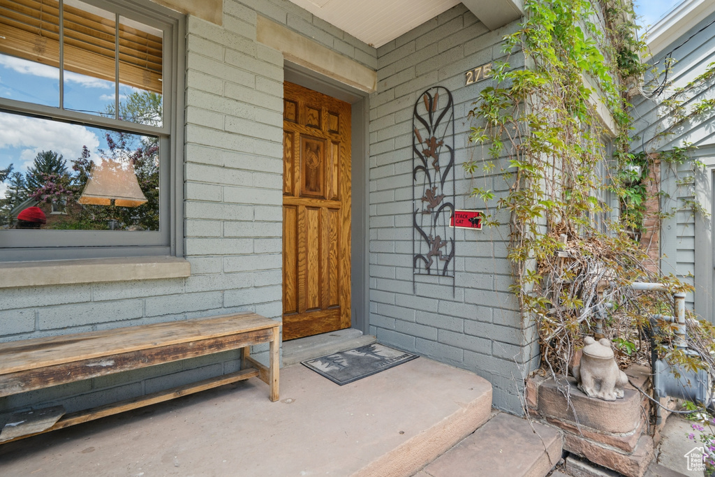 Entrance to property featuring a porch