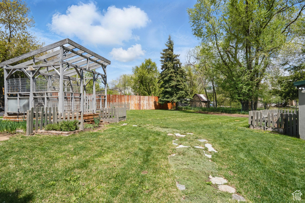 View of yard featuring an exterior structure and an outdoor structure