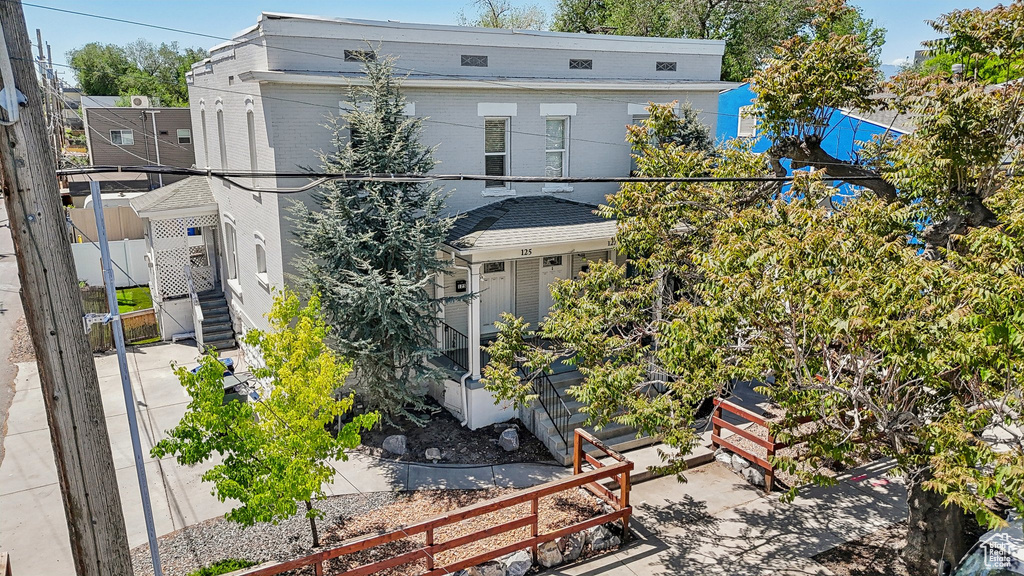 View of front of house featuring fence