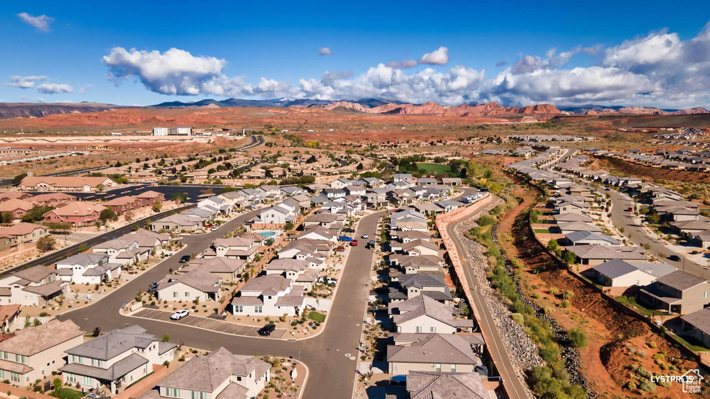View of property location featuring nearby suburban area and mountains