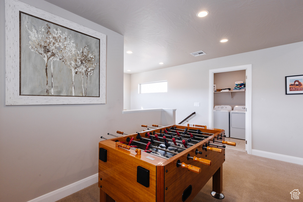 Playroom with washer and clothes dryer, carpet flooring, baseboards, and recessed lighting