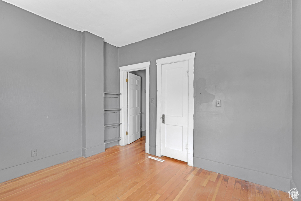 Spare room with light wood finished floors and baseboards