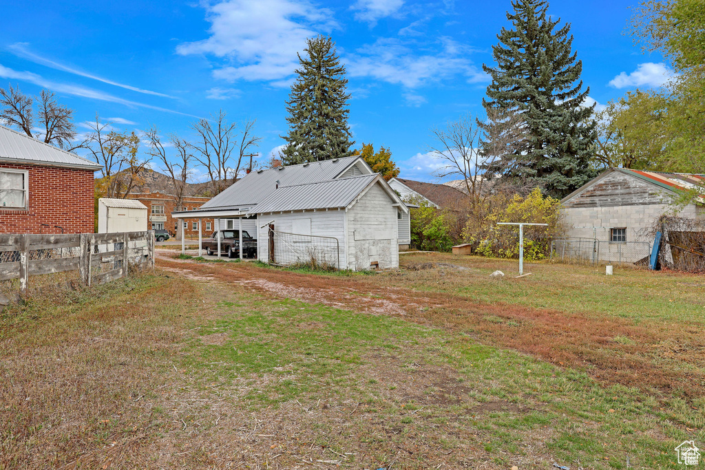 Back of property with metal roof
