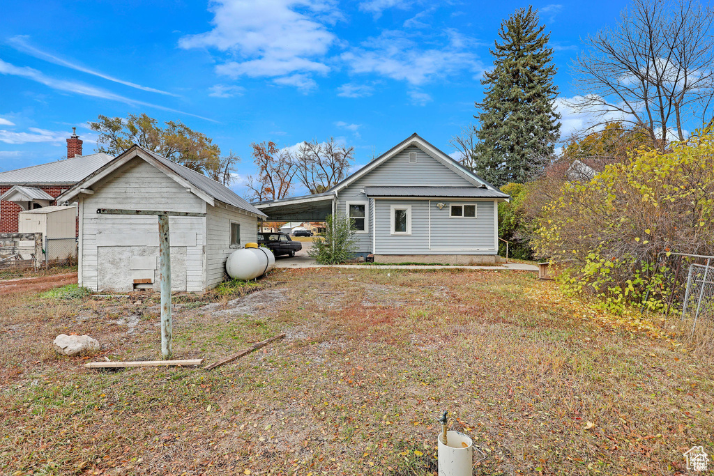 View of front of property featuring fence