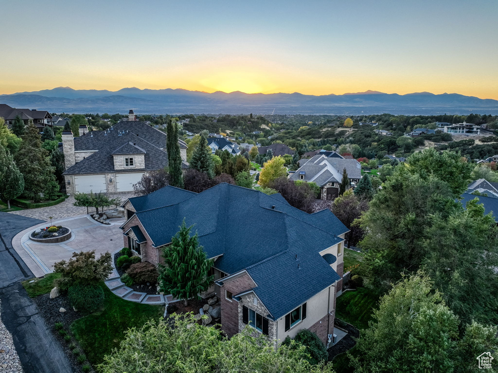 Aerial view of residential area featuring a mountain backdrop