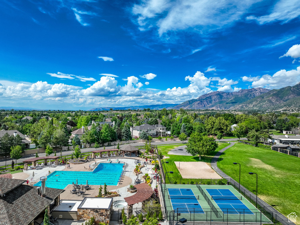 Drone / aerial view of a pool and a mountainous background