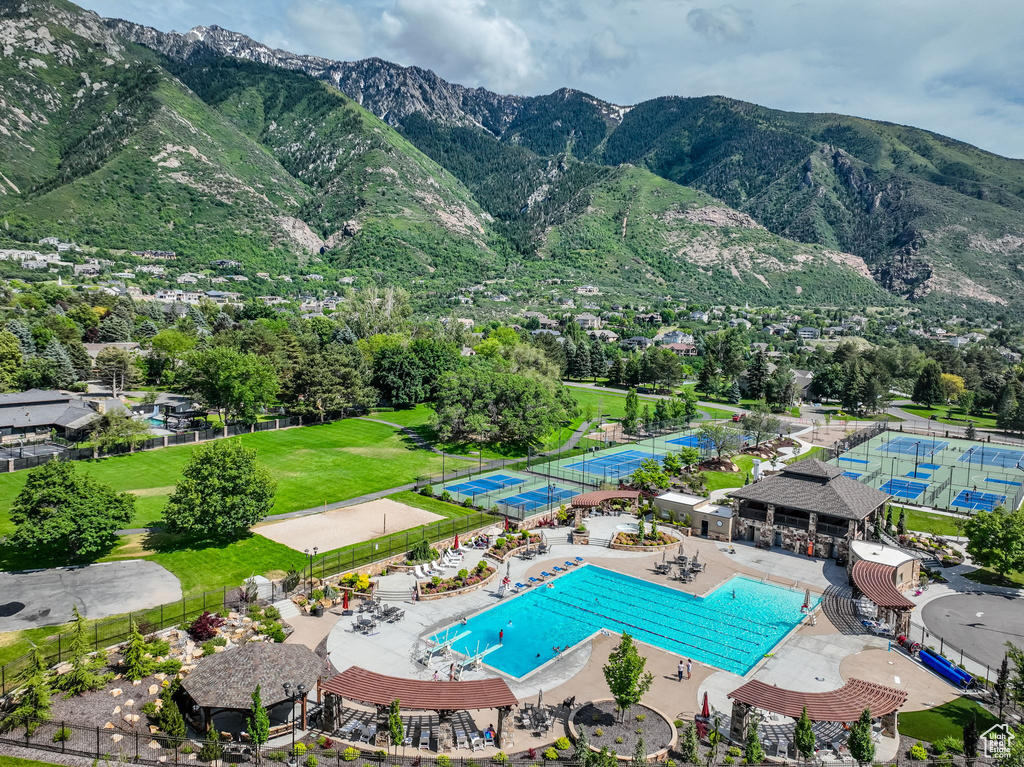 Aerial view of a pool and a mountainous background