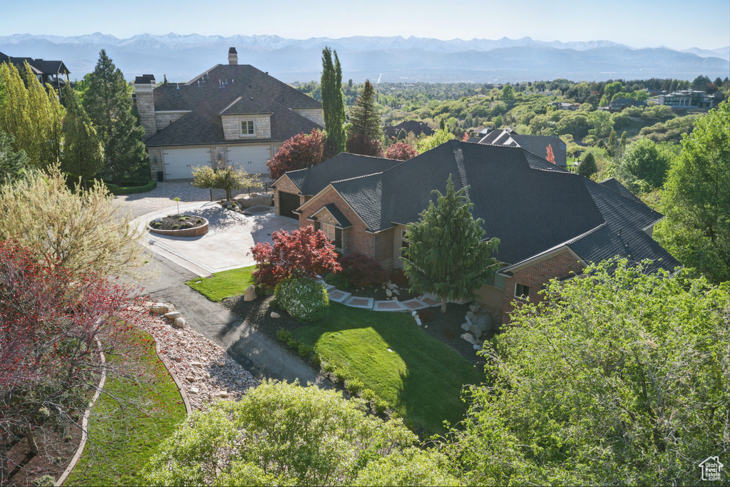 View of subject property featuring a mountainous background