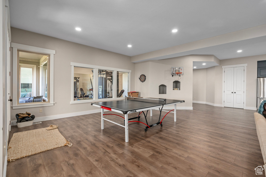 Game room featuring recessed lighting, wood finished floors, baseboards, and french doors