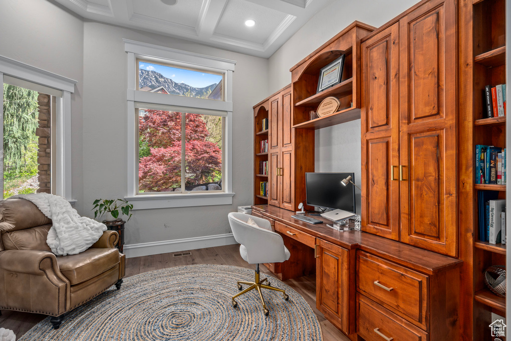 Office featuring wood finished floors, healthy amount of natural light, coffered ceiling, beam ceiling, and baseboards