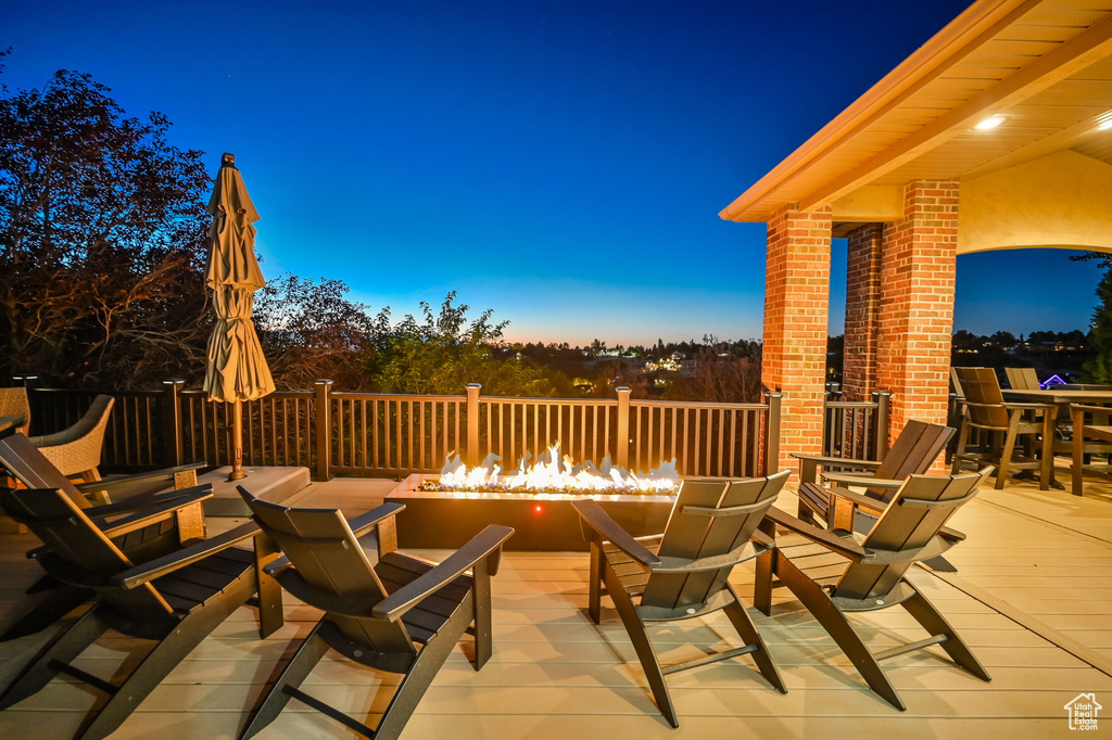 View of patio featuring an outdoor fire pit and outdoor dining area