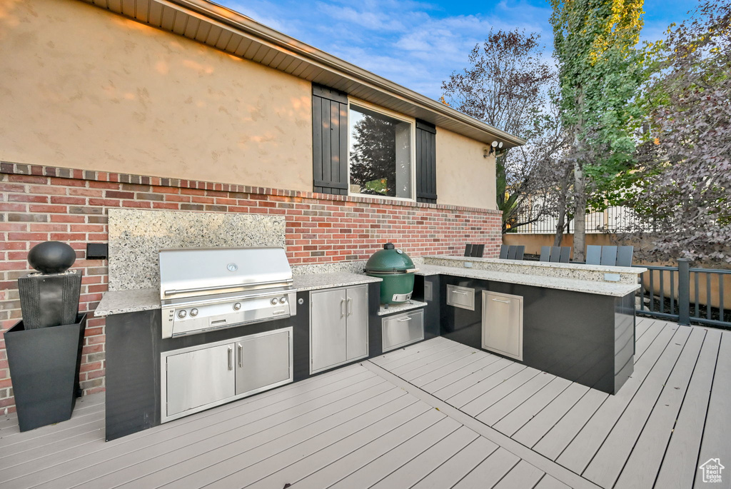 Deck with area for grilling and exterior kitchen