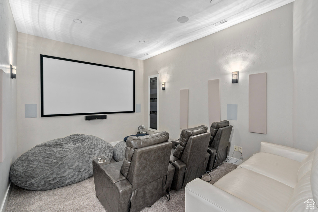 Carpeted cinema room featuring baseboards