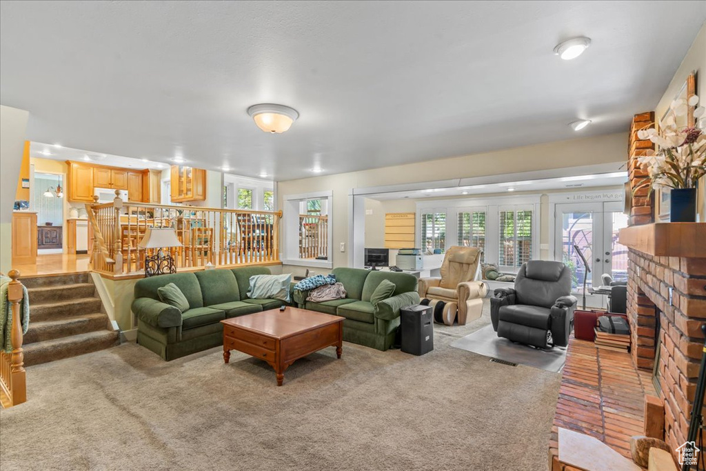 Living area with carpet floors and stairs