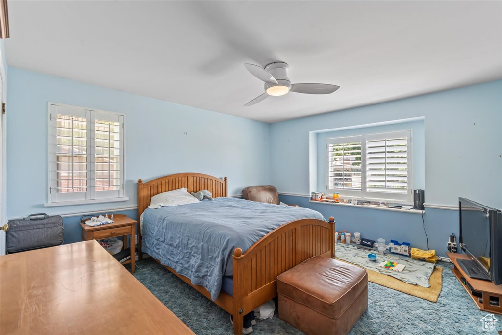 Bedroom with carpet flooring and ceiling fan