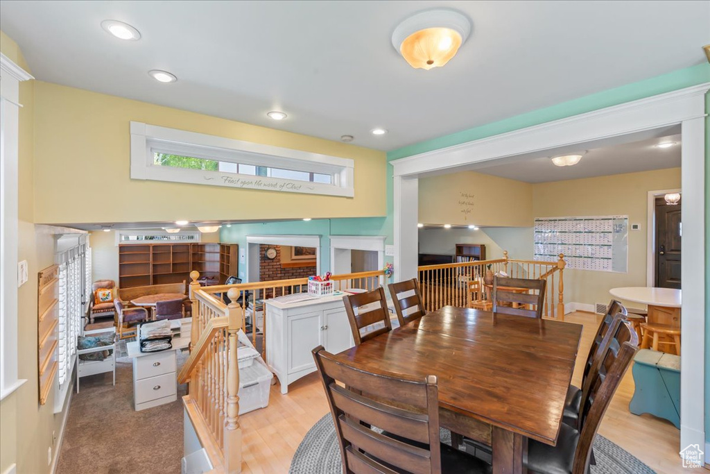 Dining area featuring light wood-style flooring and recessed lighting