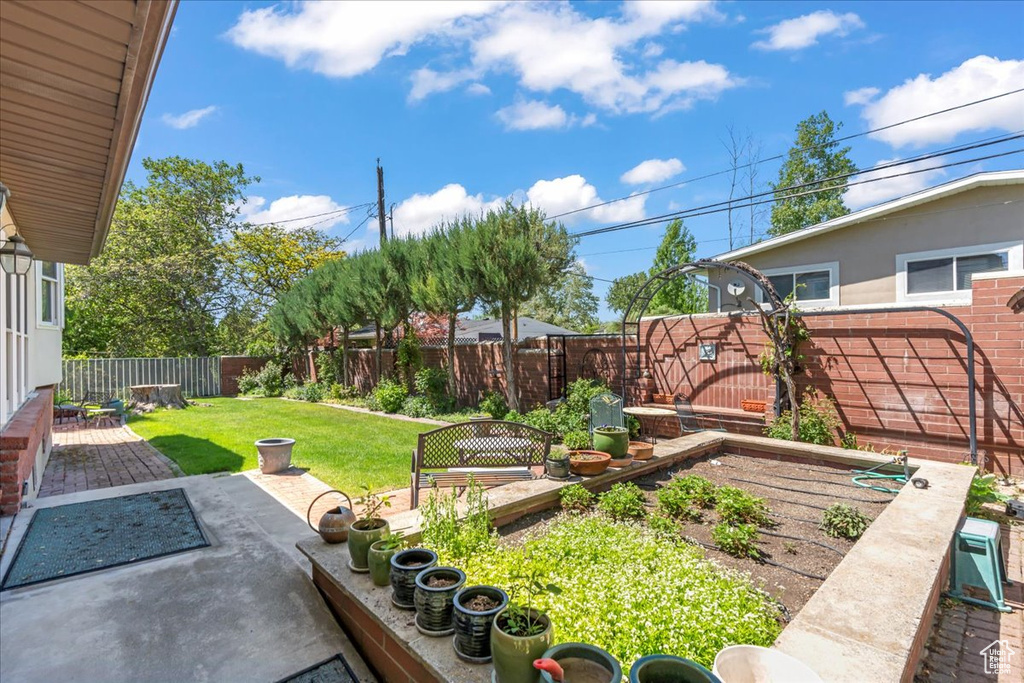 View of yard featuring a vegetable garden