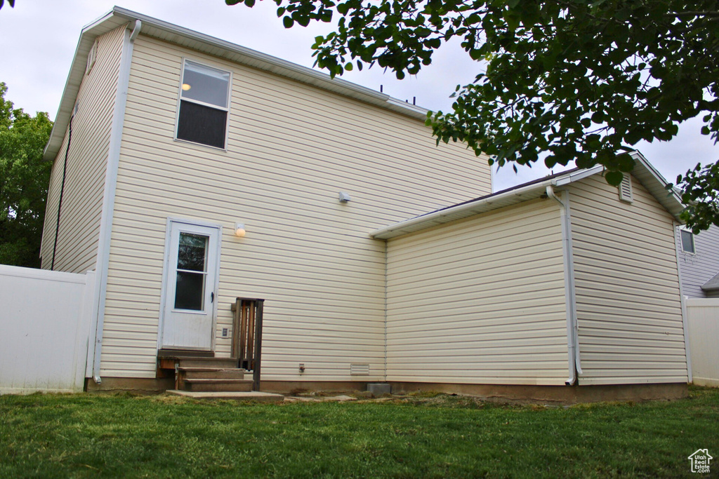 Rear view of property featuring entry steps