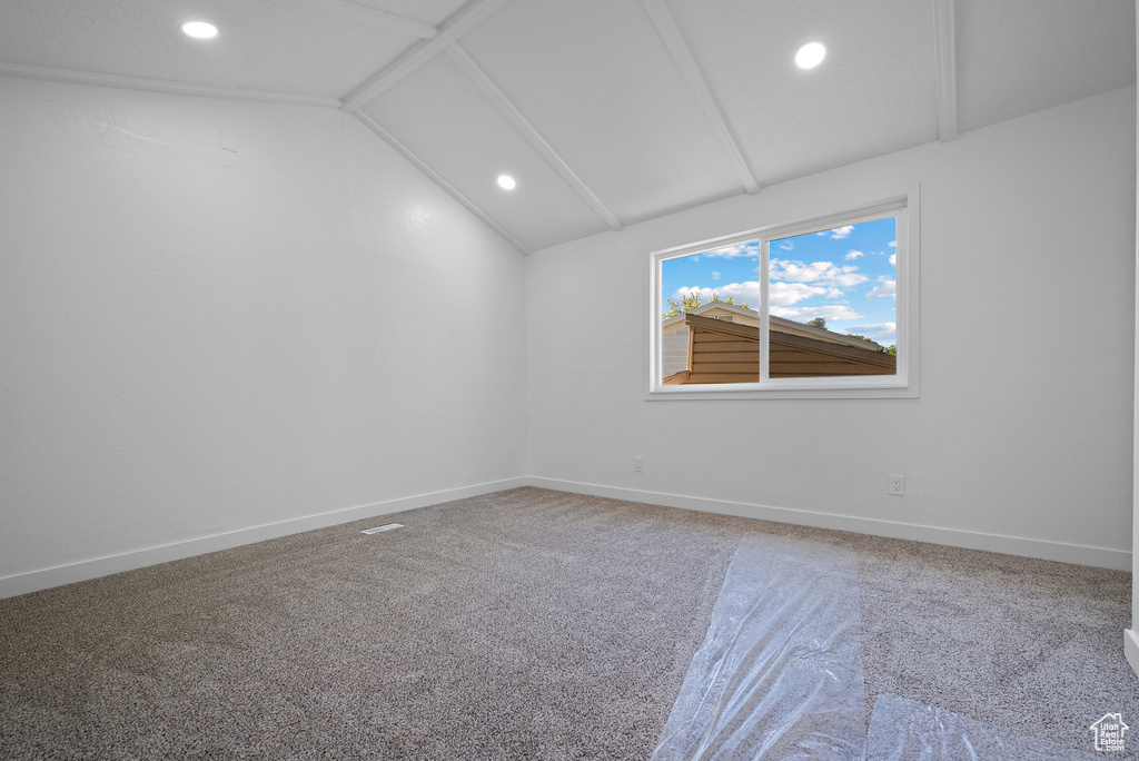 Spare room featuring recessed lighting, carpet flooring, and baseboards