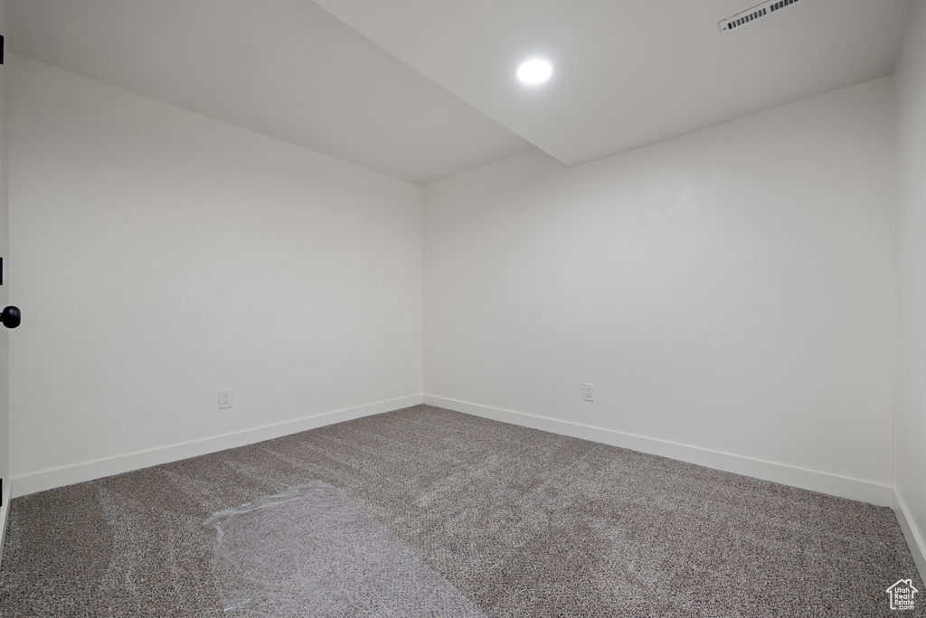 Spare room with carpet floors and baseboards
