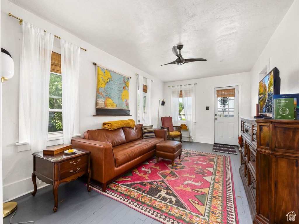 Living area featuring hardwood / wood-style flooring and baseboards