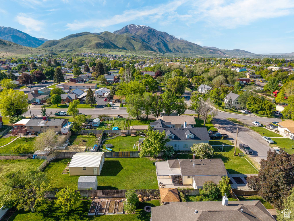 Aerial view of residential area featuring a mountainous background