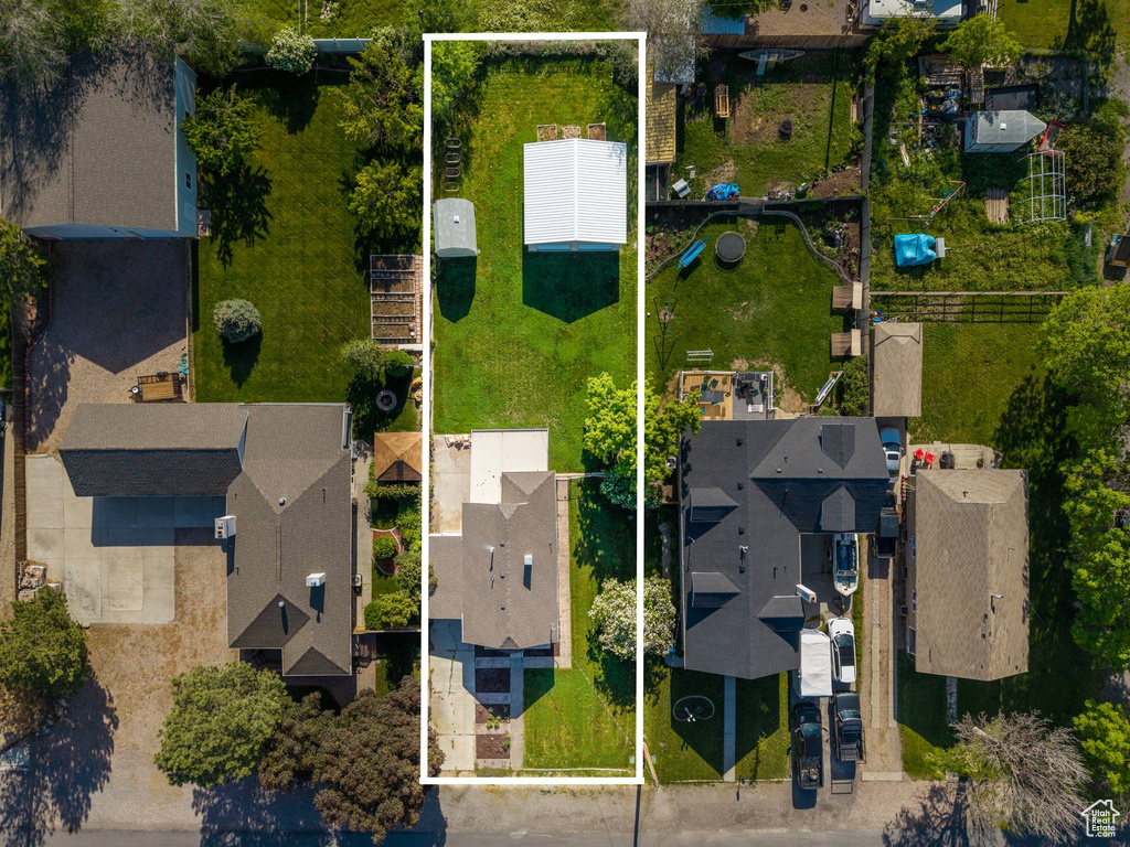 Aerial perspective of suburban area featuring property parcel outlined