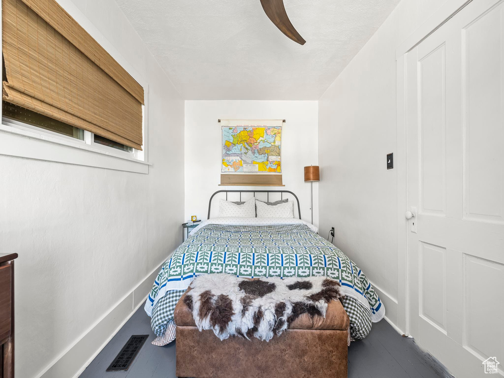 Bedroom with baseboards and a ceiling fan