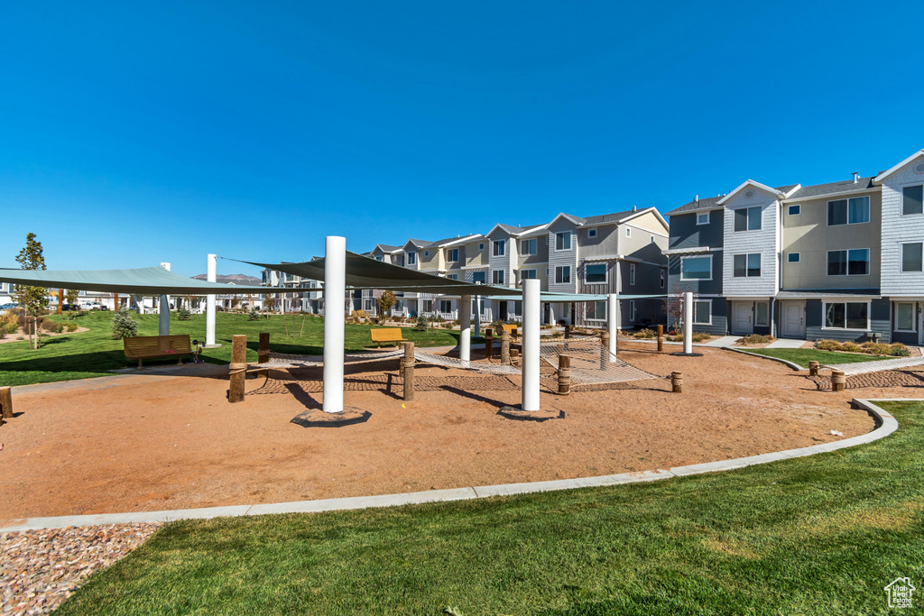 Surrounding community with a residential view, a gazebo, and a lawn
